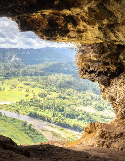 A vista of the Dorado region viewed through a limestone cave window